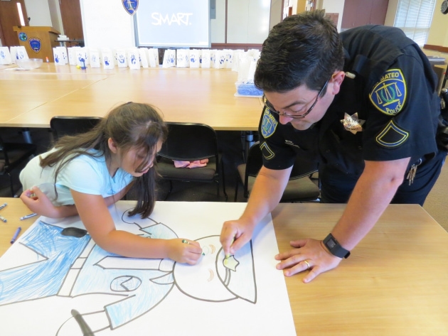 officer and child drawing